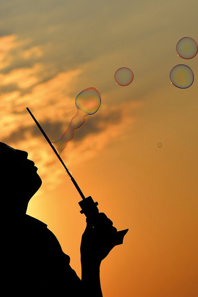 Blowing bubbles into the sunset